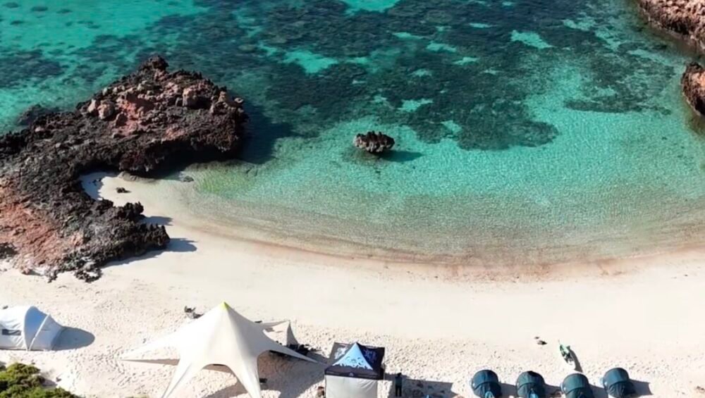 dimaniyat island white sand beach camping